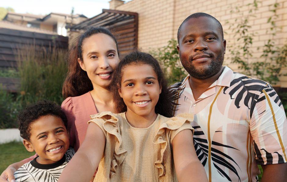 Family embracing outdoors