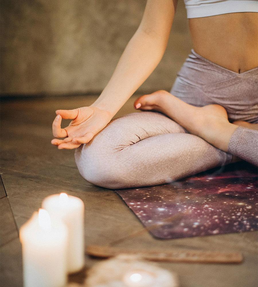 Person meditating during a wellness group session