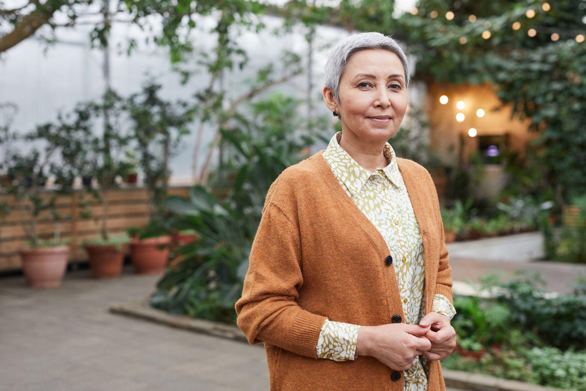 Senior woman smiling in a garden