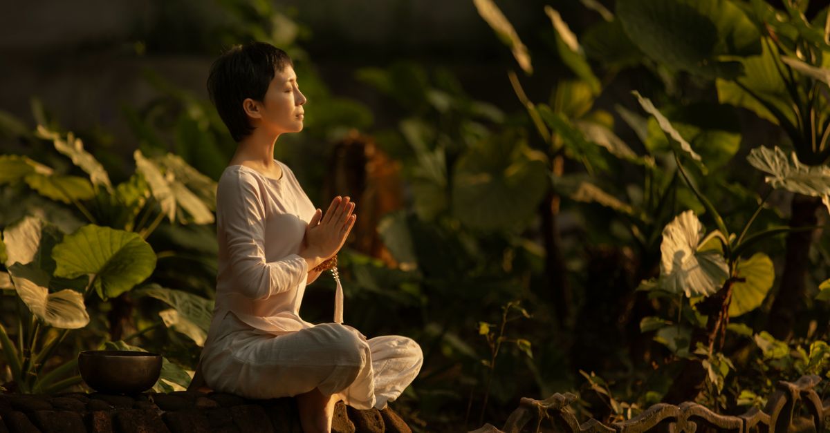Person practicing calm breathing in nature